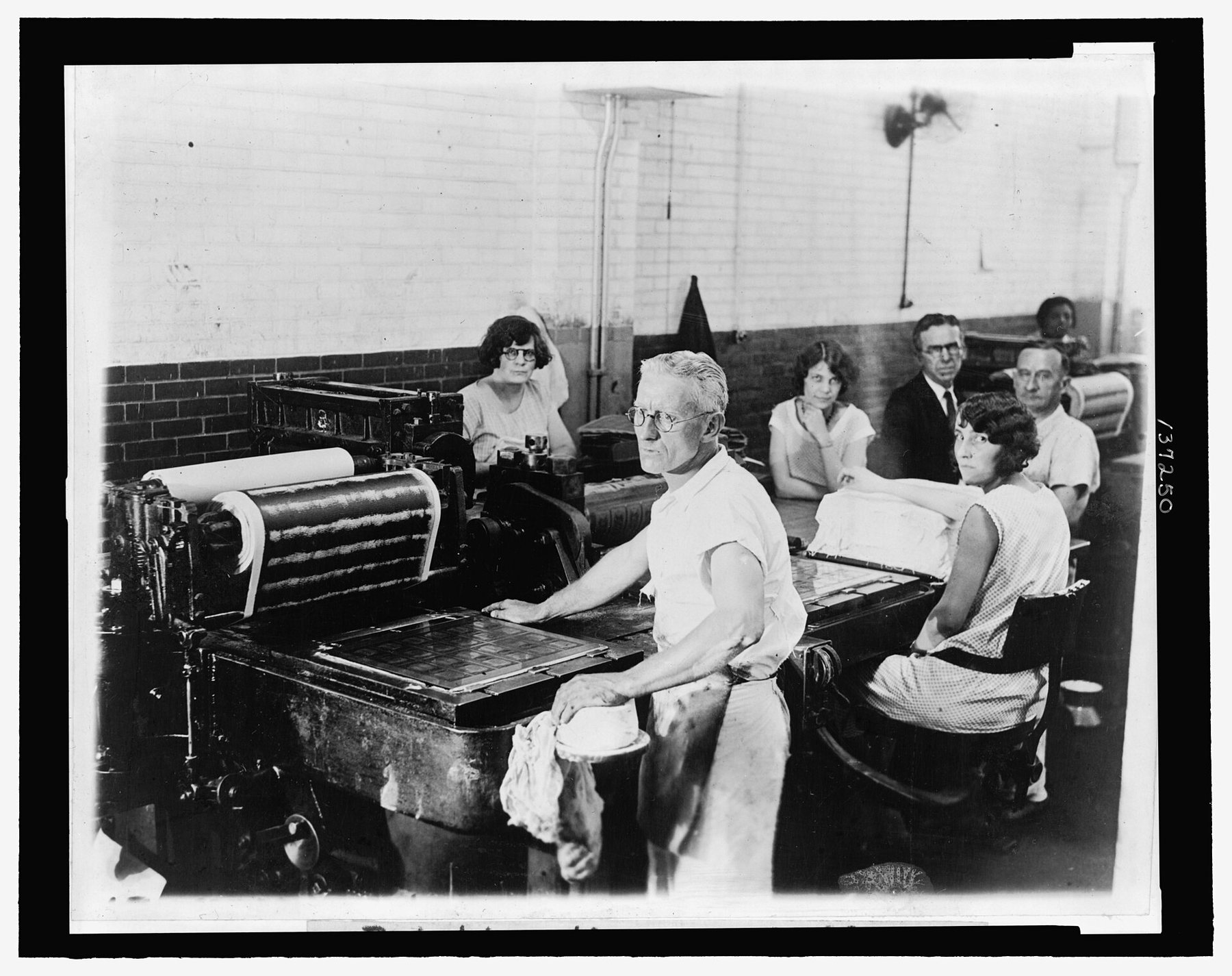 Sheets of currency coming off a press at the Bureau of Engraving and Printing